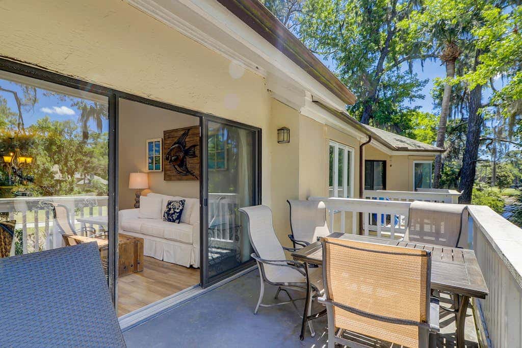 Sun-kissed bliss at Colonnade Club with dual suites, deck, shared pool, hot tub