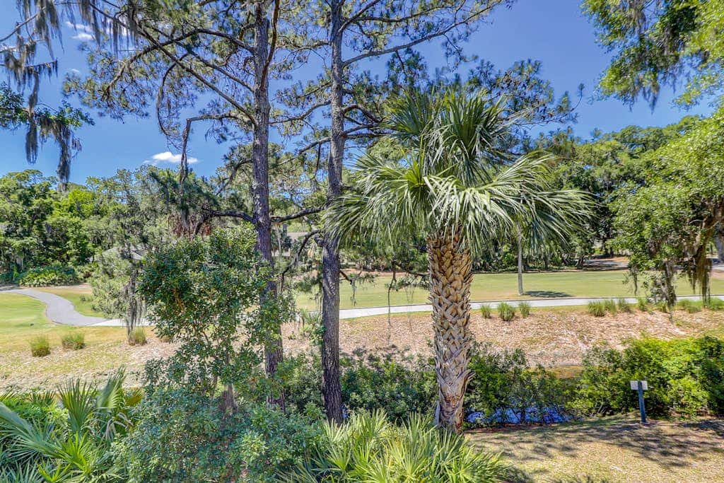 Sun-kissed bliss at Colonnade Club with dual suites, deck, shared pool, hot tub