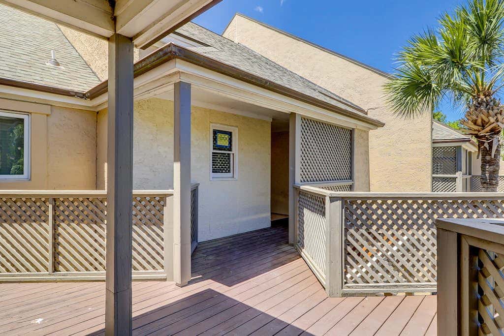 Sun-kissed bliss at Colonnade Club with dual suites, deck, shared pool, hot tub