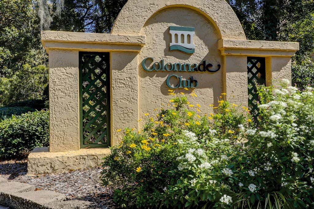 Sun-kissed bliss at Colonnade Club with dual suites, deck, shared pool, hot tub