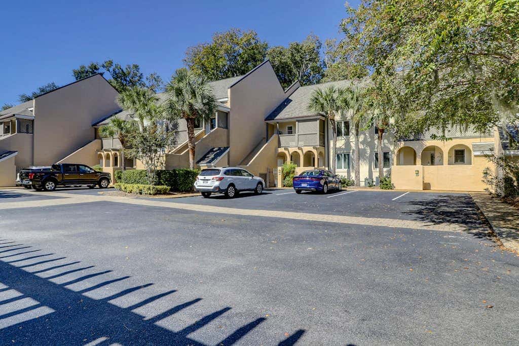 Sun-kissed bliss at Colonnade Club with dual suites, deck, shared pool, hot tub