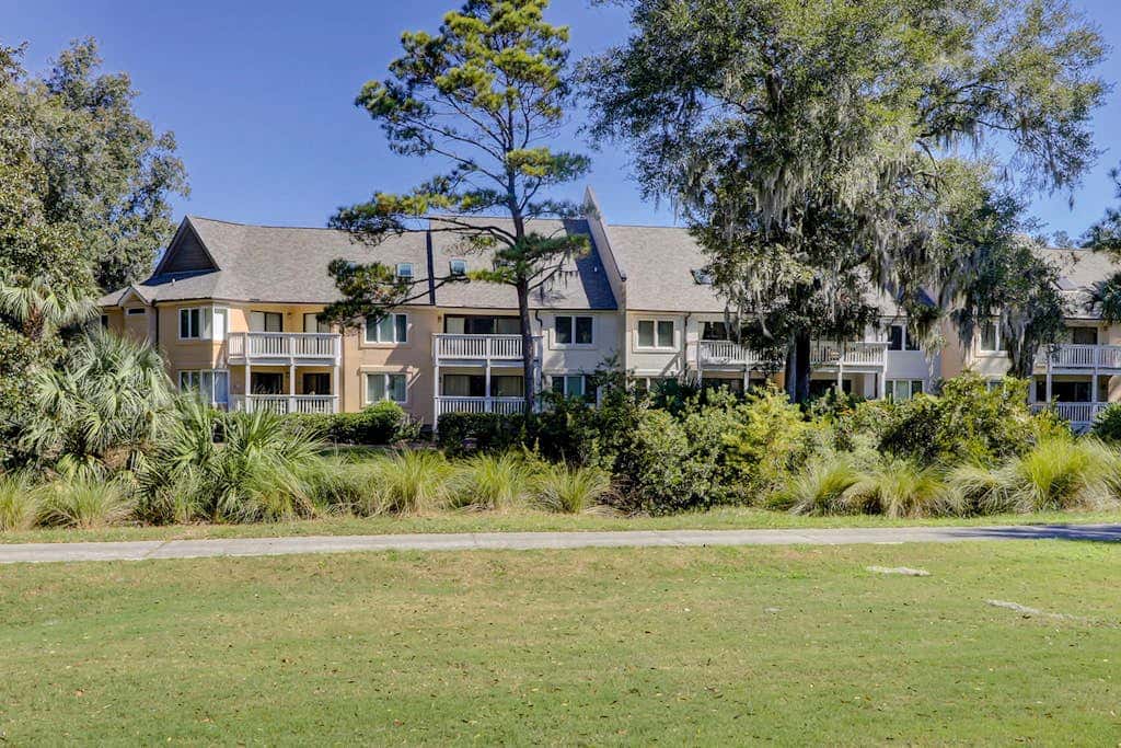 Sun-kissed bliss at Colonnade Club with dual suites, deck, shared pool, hot tub