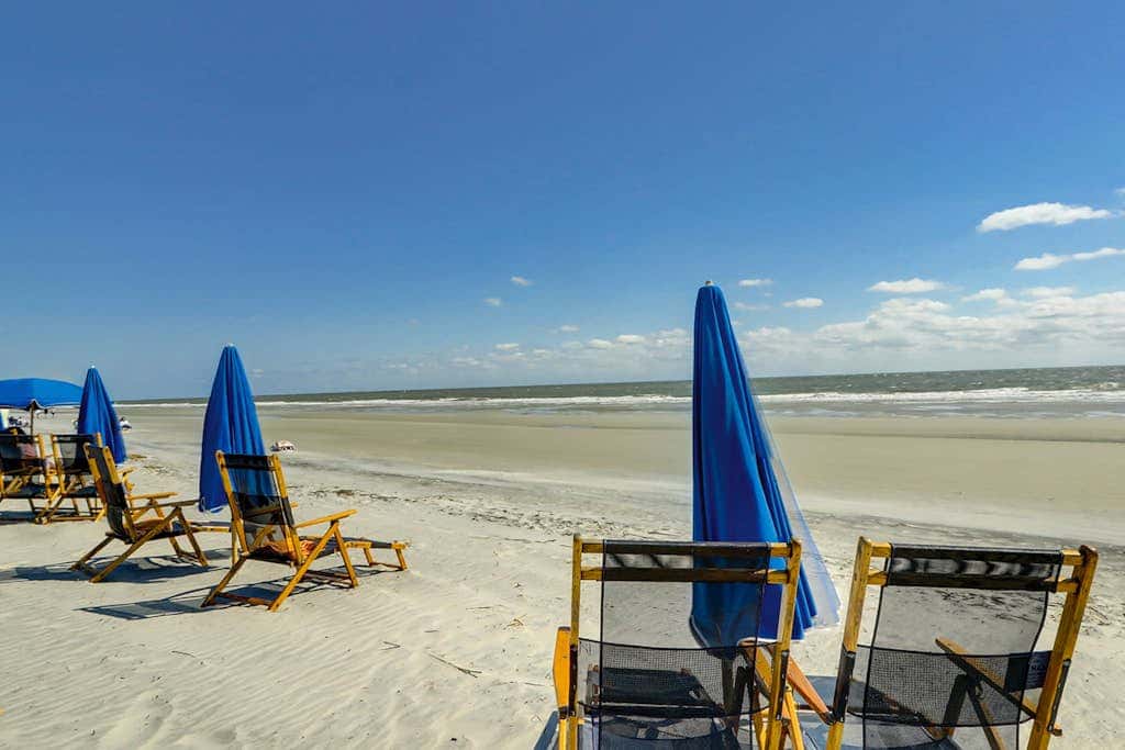 Sun-kissed bliss at Colonnade Club with dual suites, deck, shared pool, hot tub