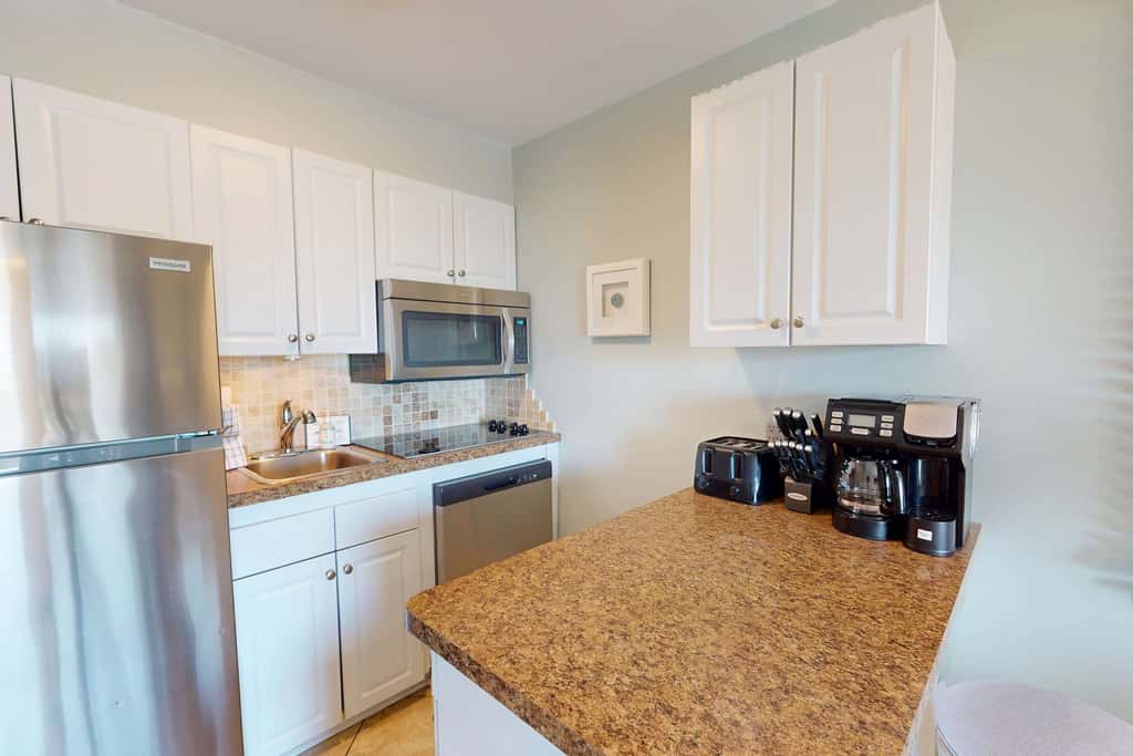 Beach-view condo in oceanfront complex with outdoor pool, beach access & balcony
