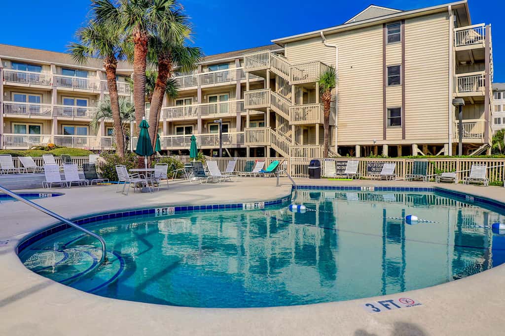 Beach-view condo in oceanfront complex with outdoor pool, beach access & balcony