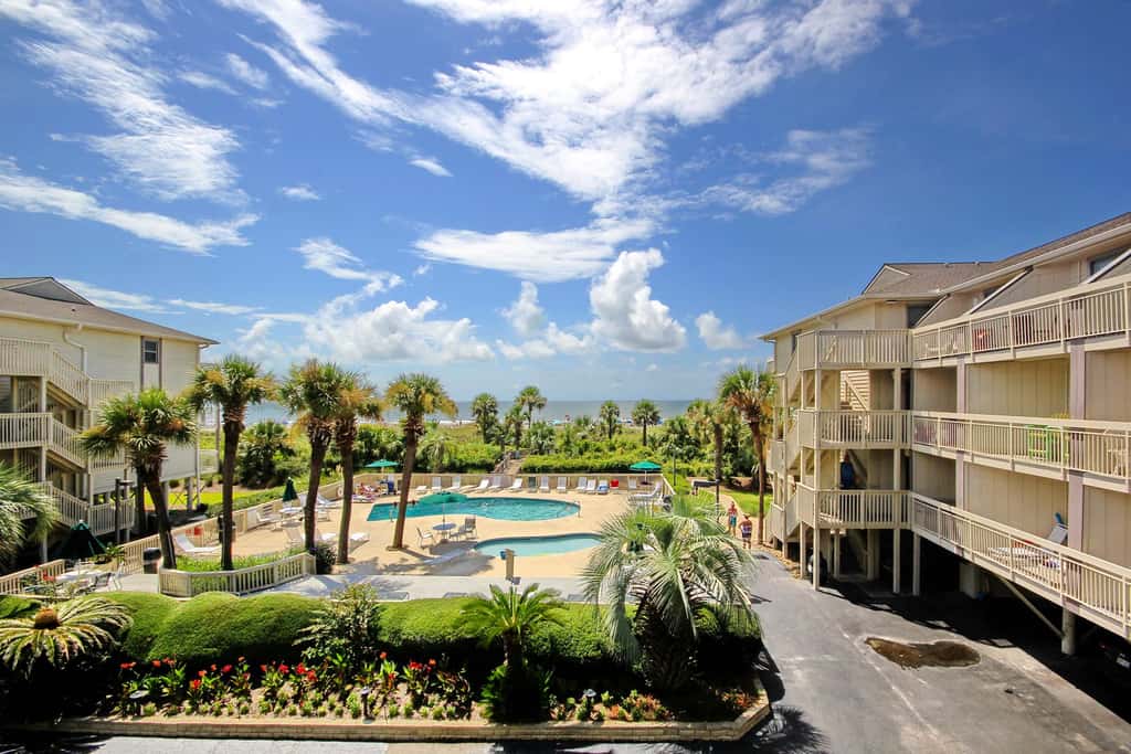 Beach-view condo in oceanfront complex with outdoor pool, beach access & balcony