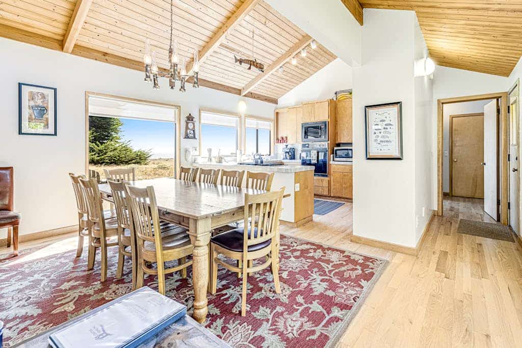 Settle into a home where the ocean is always part of the conversation. Soak in the hot tub as the sun dips below the Pacific. Your deck is a front-row seat to the Pacific. Room for 8 in this 3-bedroom home. A short walk from the heated community pool. Trails, tidepools, and two heated community pools -- all within reach. The bluff trail starts steps from the door, winding along the cliffs above crashing whitecaps.