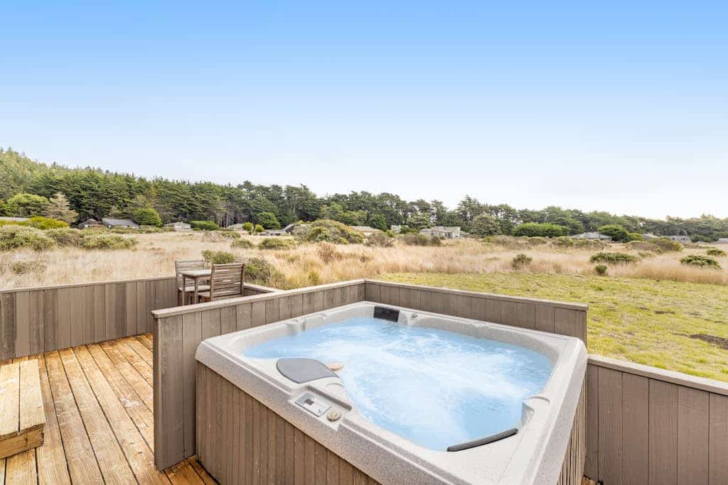 Settle into a home where the ocean is always part of the conversation. Soak in the hot tub as the sun dips below the Pacific. Bring your pup -- dogs love the bluff trails here. Room for 8 in this 3-bedroom home. Sea Ranch community pools, tennis courts, and the Lodge are nearby. The Sonoma Coast's best-kept secret is waiting for you. The ocean soundtrack never stops here -- waves at dawn, crashing surf at dusk.