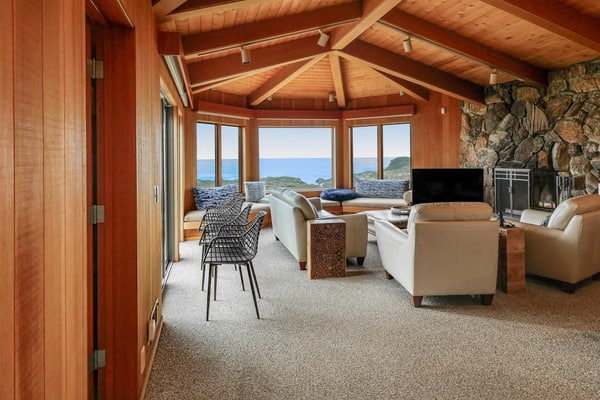 The ocean is your backyard -- hear the waves from every room in this coastal haven. Curl up under a cozy blanket as fog rolls in off the Pacific. Warm up in the community sauna after a brisk beach walk. Room for 6 in this 3-bedroom home. Just a 9-minute walk to the heated community pool. Your front door opens to Sea Ranch's 50 miles of trails and the wild Sonoma Coast. Cormorants dive and otters float just offshore -- nature's channel plays 24/7 from the windows.