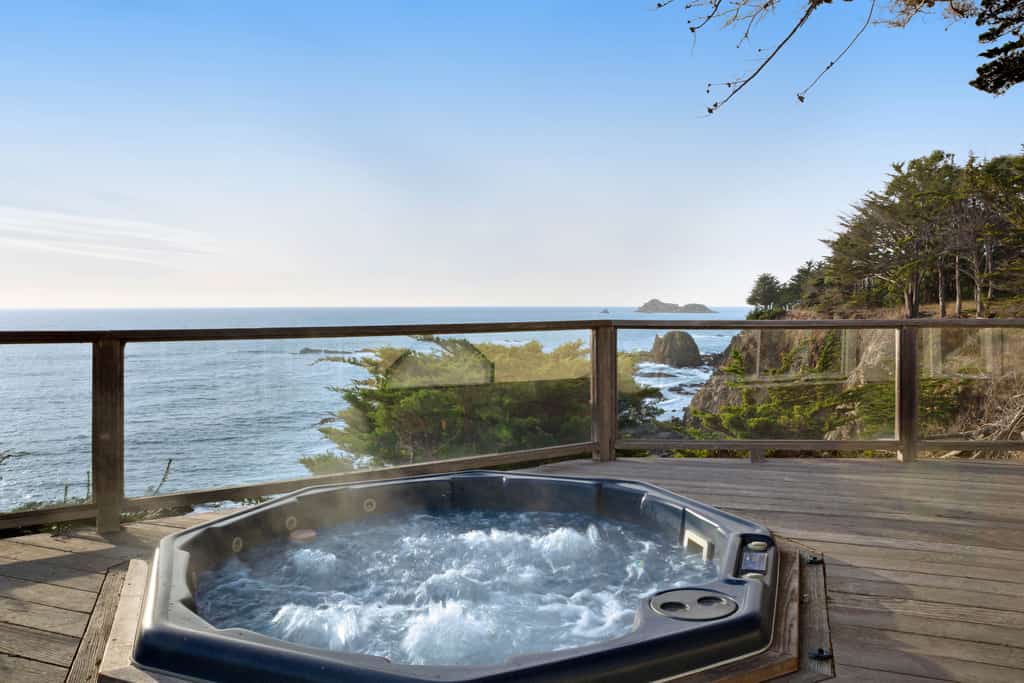 Salt spray, crashing waves, and a front-row seat to the Pacific -- welcome to the Sonoma Coast. End the day in your private hot tub with the ocean as your soundtrack. A warm fire and ocean views anchor cozy evenings in. Room for 4 in this 2-bedroom home. Walk to local restaurants. River access and Gualala Point Regional Park are a short drive away. Art galleries, river trails, and the wild Pacific are all within reach.