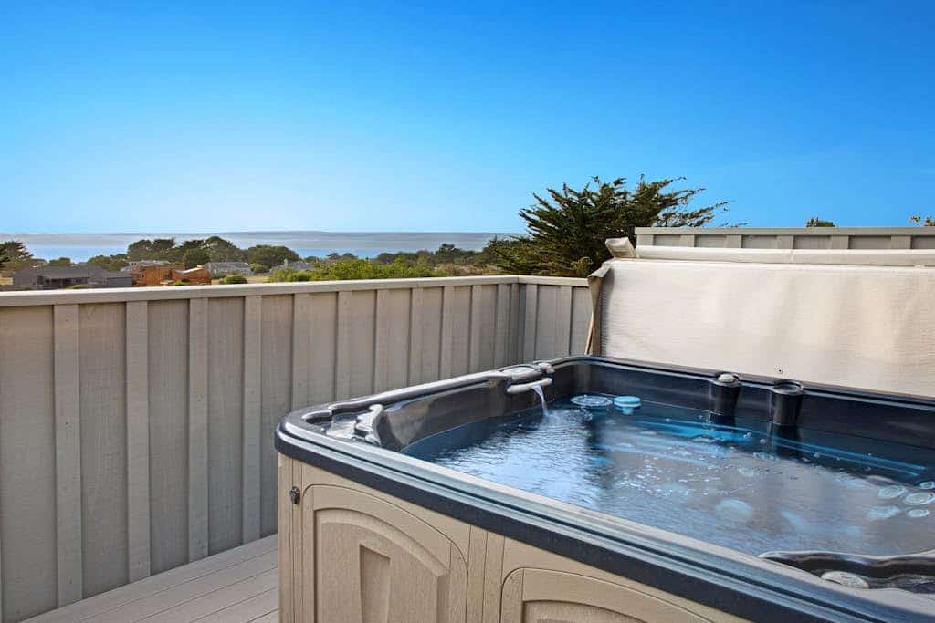 The Pacific shimmers in the distance as you unwind in this Sea Ranch retreat. Soak in the hot tub as the sun dips below the Pacific. A warm fire and ocean views anchor cozy evenings in. Room for 6 in this 2-bedroom home. Just a 11-minute walk to the heated community pool. Whale watching, sunset hikes, and starlit skies -- the coast is calling. Salt air drifts through the windows as the Pacific puts on its daily show just beyond the deck.
