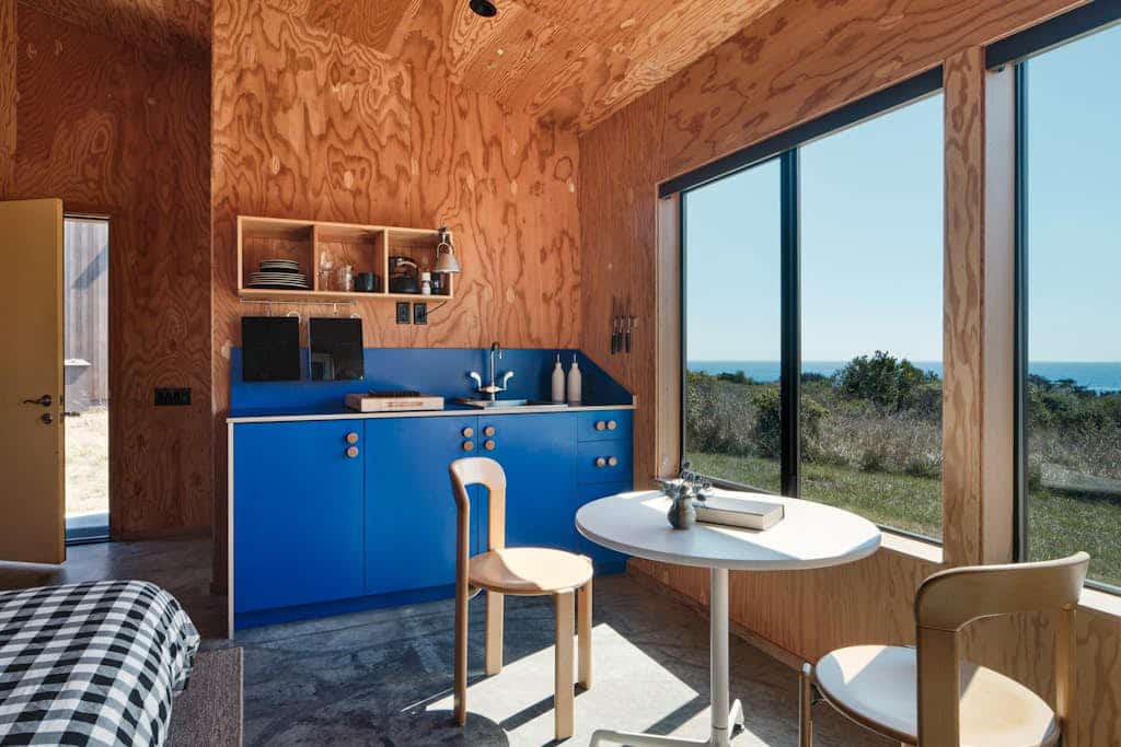 Sunsets paint the sky in oranges and pinks from this ocean-view Sea Ranch home. Warm up in the community sauna after a brisk beach walk. A cozy 0-bedroom retreat for two. Just a 10-minute walk to Shell Beach tidepools. Architecture, nature, and the Pacific -- Sea Ranch has it all. At low tide, the rock shelves reveal a hidden world of anemones, crabs, and starfish. Summer fog burns off by midday, leaving warm afternoons perfect for trail hikes and tidepooling.