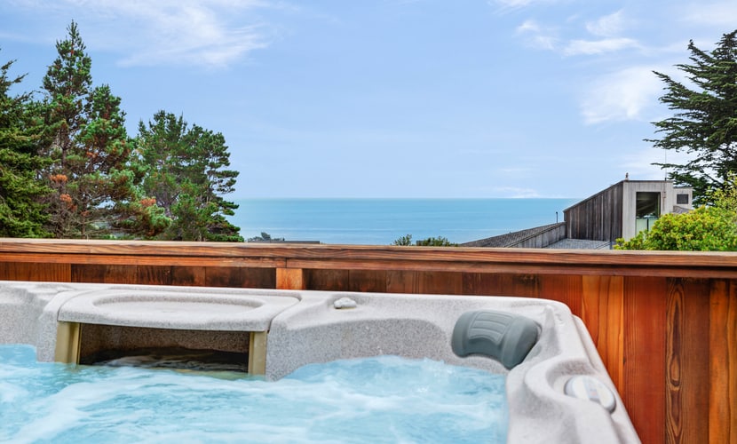 Your deck doubles as a whale-watching station during migration season at this ocean-view retreat. Soak in the hot tub as the sun dips below the Pacific. Bring your pup -- dogs love the bluff trails here. Room for 6 in this 2-bedroom home. Sea Ranch community pools, tennis courts, and the Lodge are nearby. Your front door opens to Sea Ranch's 50 miles of trails and the wild Sonoma Coast. Nothing resets your pace like watching the tide come and go from your own living room.