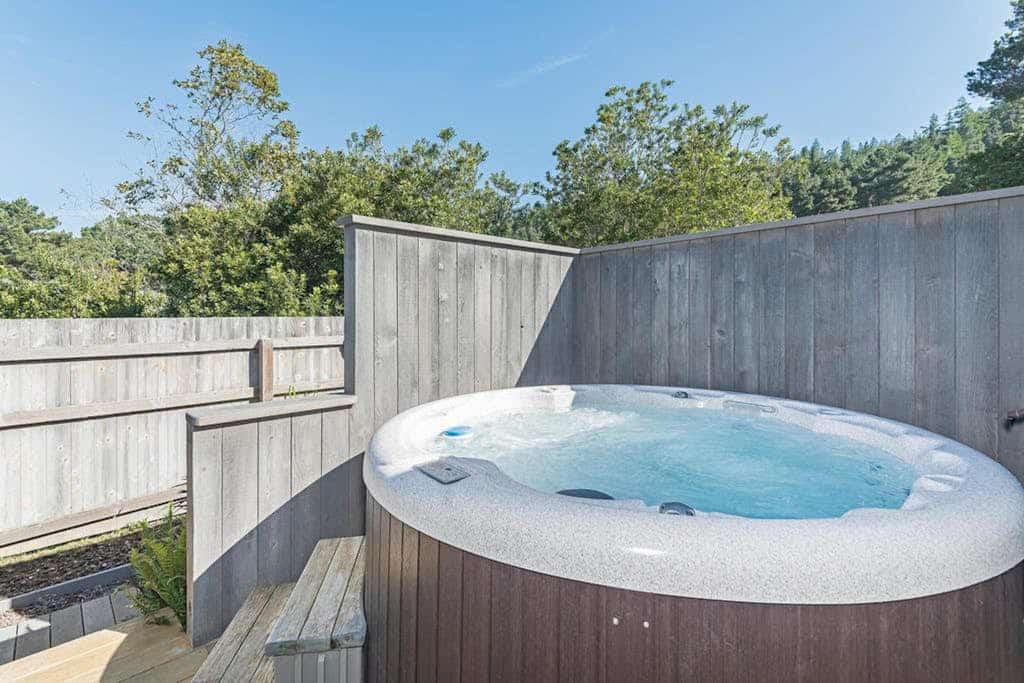 Fog, sun, and sea -- the ever-changing coastal light makes every morning feel new. End the day in your private hot tub with the ocean as your soundtrack. Curl up by the fireplace as fog rolls in off the Pacific. Room for 4 in this 2-bedroom home. Sea Ranch community pools, tennis courts, and the Lodge are nearby. Architecture, nature, and the Pacific -- Sea Ranch has it all. The bluff trail starts steps from the door, winding along the cliffs above crashing whitecaps.