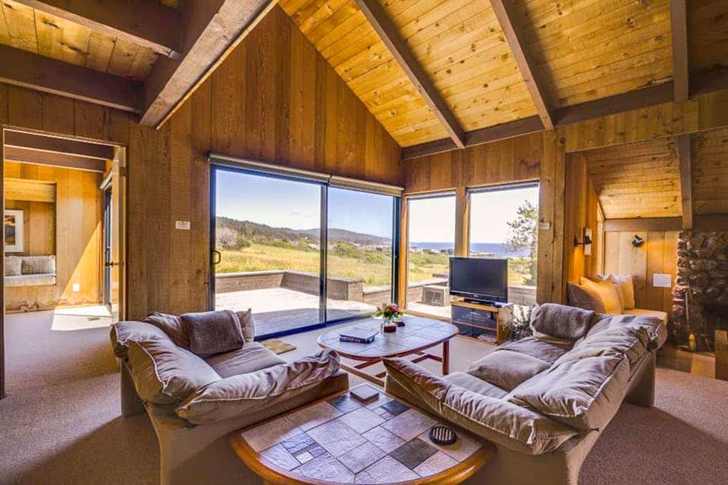 Perched between Shell Beach and Stengel Beach, this Sea Ranch retreat pairs a rare, sweeping ocean view with the architecture the community is famous for: cedar walls, soaring ceilings, and a fireplace built for long, easy evenings. With two private bedroom suites and a loft designed for up to four guests, you have room to spread out with someone you love or share the week with another couple, and still come back together as the day winds down. 