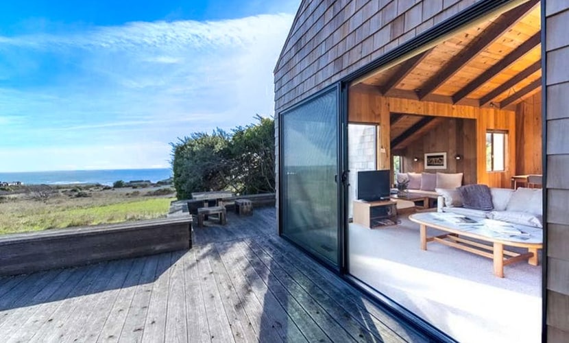 Perched between Shell Beach and Stengel Beach, this Sea Ranch retreat pairs a rare, sweeping ocean view with the architecture the community is famous for: cedar walls, soaring ceilings, and a fireplace built for long, easy evenings. With two private bedroom suites and a loft designed for up to four guests, you have room to spread out with someone you love or share the week with another couple, and still come back together as the day winds down.