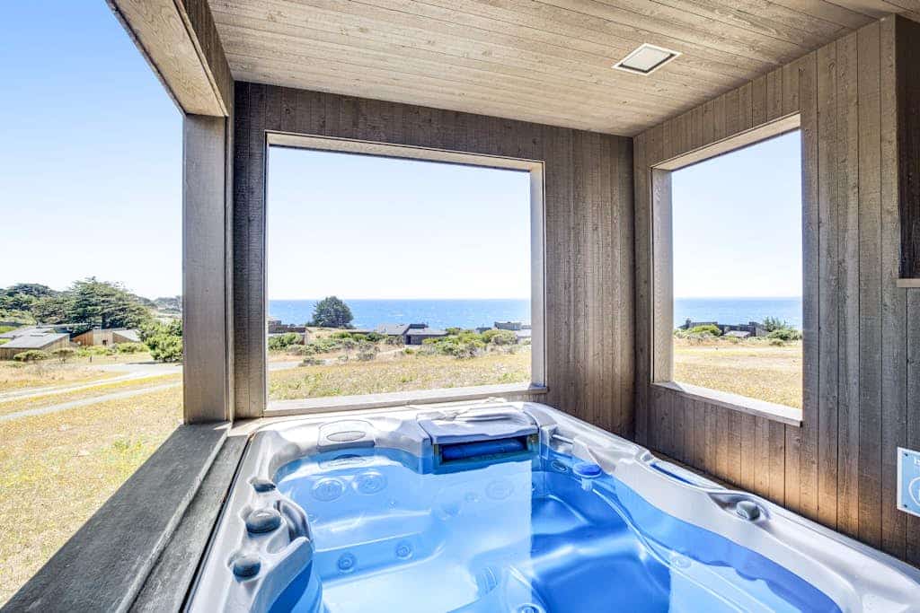 Morning fog lifts to reveal blue Pacific horizons -- this is ocean-view living at its best. End the day in your private hot tub with the ocean as your soundtrack. Curl up by the fireplace as fog rolls in off the Pacific. Room for 6 in this 2-bedroom home. A short walk from the heated community pool. Architecture, nature, and the Pacific -- Sea Ranch has it all. On still nights the stars are overwhelming -- no city light for miles in any direction.