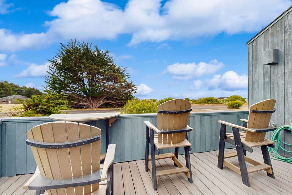 From the living room to the deck, the Pacific is always in view at this coastal home. End the day in your private hot tub with the ocean as your soundtrack. Bring your pup -- dogs love the bluff trails here. Room for 5 in this 2-bedroom home. Just a 6-minute walk to the heated community pool. Miles of bluff-top trails and hidden beaches are yours to explore. The bluff trail starts steps from the door, winding along the cliffs above crashing whitecaps.