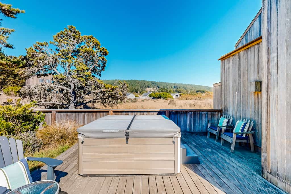 Ocean and meadow views greet you from the moment you walk through the door. Soak in the hot tub as the sun dips below the Pacific. Bring your pup -- dogs love the bluff trails here. Room for 6 in this 3-bedroom home. Sea Ranch community pools, tennis courts, and the Lodge are nearby. Whale watching, sunset hikes, and starlit skies -- the coast is calling. Whale spouts on the horizon, hawks riding the updrafts -- nature puts on a show from every window.