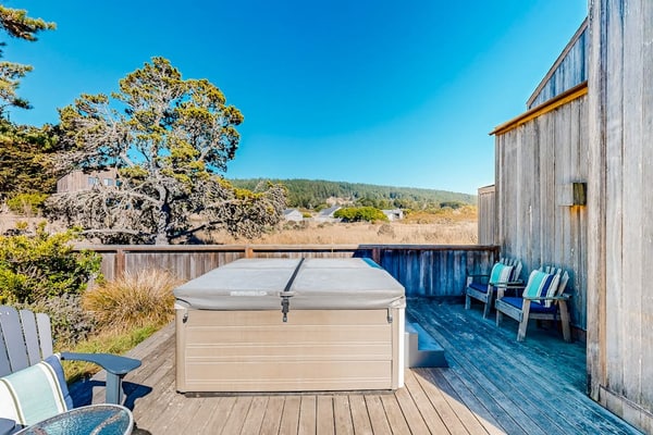 Ocean and meadow views greet you from the moment you walk through the door. Soak in the hot tub as the sun dips below the Pacific. Bring your pup -- dogs love the bluff trails here. Room for 6 in this 3-bedroom home. Sea Ranch community pools, tennis courts, and the Lodge are nearby. Whale watching, sunset hikes, and starlit skies -- the coast is calling. Whale spouts on the horizon, hawks riding the updrafts -- nature puts on a show from every window.