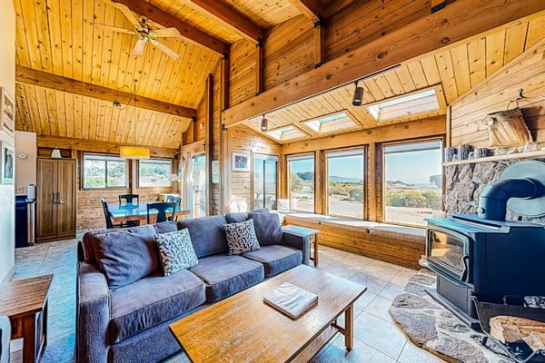 Ocean and meadow views greet you from the moment you walk through the door. Soak in the hot tub as the sun dips below the Pacific. Bring your pup -- dogs love the bluff trails here. Room for 6 in this 3-bedroom home. Sea Ranch community pools, tennis courts, and the Lodge are nearby. Whale watching, sunset hikes, and starlit skies -- the coast is calling. Whale spouts on the horizon, hawks riding the updrafts -- nature puts on a show from every window.