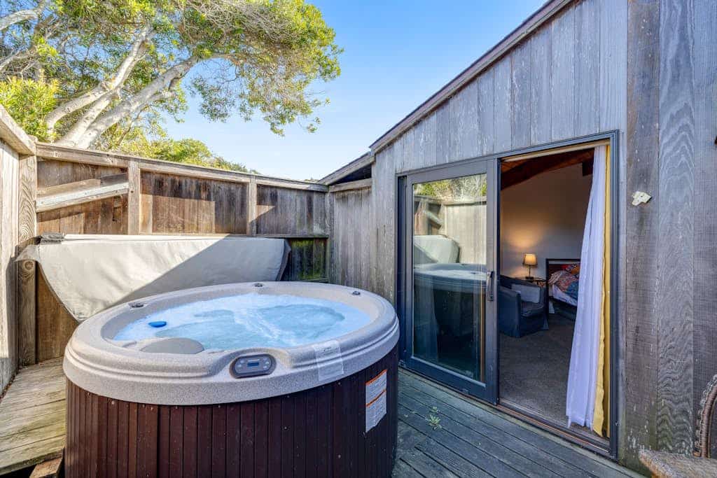 Your deck doubles as a whale-watching station during migration season at this ocean-view retreat. Soak in the hot tub as the sun dips below the Pacific. Bring your pup -- dogs love the bluff trails here. Room for 8 in this 3-bedroom home. Sea Ranch community pools, tennis courts, and the Lodge are nearby. Whale watching, sunset hikes, and starlit skies -- the coast is calling. The light here shifts by the hour -- silver mornings, gold afternoons, pink-and-orange sunsets.