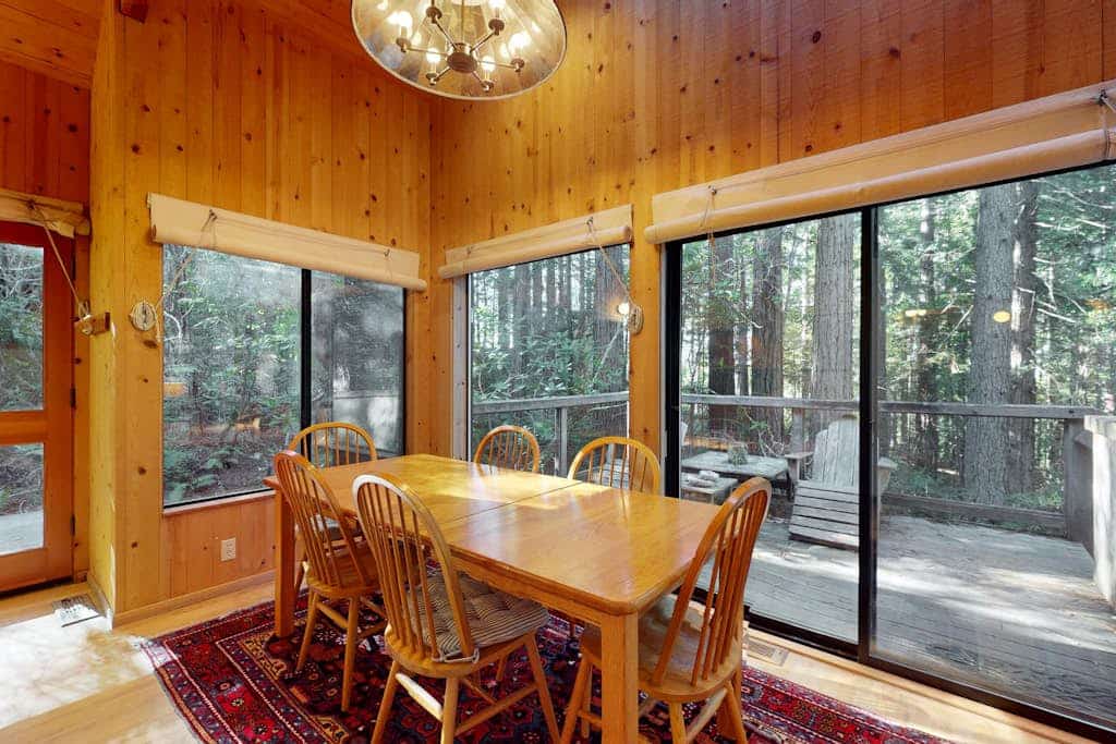 Forest light filters through the canopy onto this secluded Sea Ranch gem. End the day in your private hot tub surrounded by forest quiet. A warm fire anchors cozy evenings after forest hikes. Room for 4 in this 2-bedroom home. Sea Ranch community pools, tennis courts, and the Lodge are nearby. Trails, tidepools, and two heated community pools -- all within reach. Wildflower meadows and shaded forest trails start right outside your door.