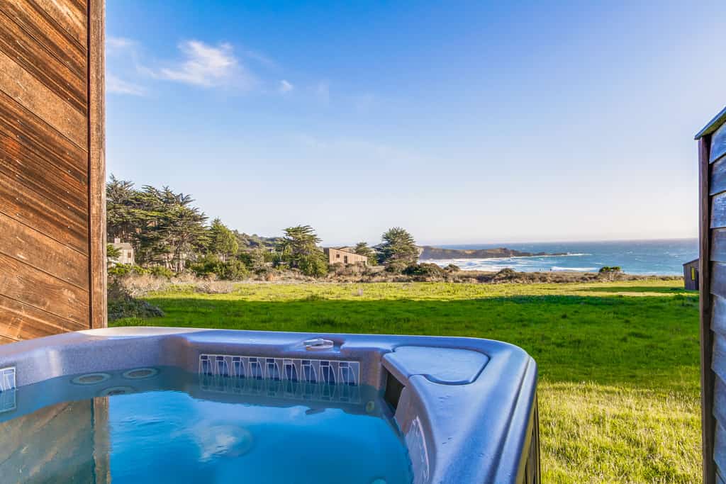 Catch the sunset over the Pacific every evening from your own private deck. Soak in the hot tub as the sun dips below the Pacific. A warm fire and ocean views anchor cozy evenings in. Room for 6 in this 3-bedroom home. Near the heated community pool. Sea Ranch's iconic trails, tidepools, and heated pools are all at your doorstep. The rugged Sonoma coastline unfolds from the deck -- raw, dramatic, and endlessly watchable.