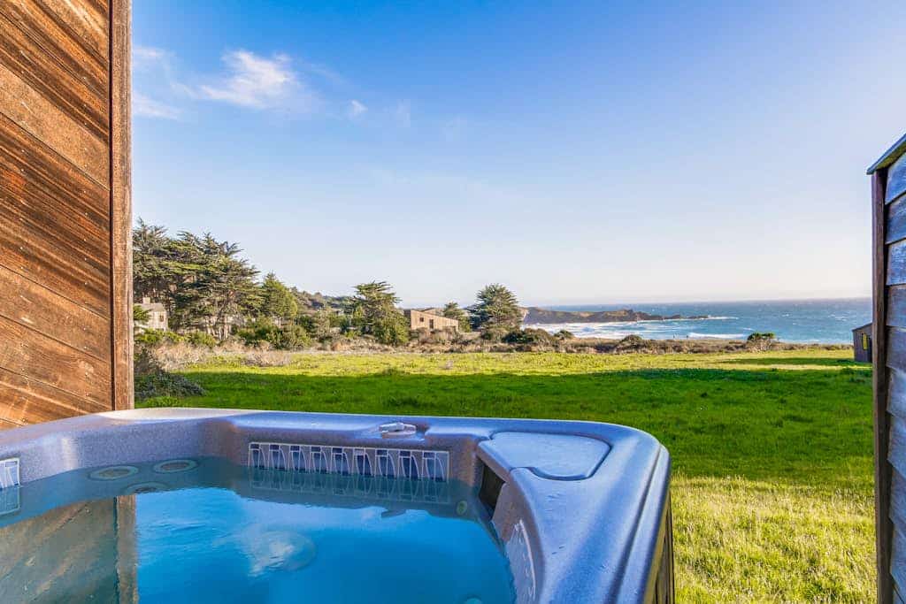 Catch the sunset over the Pacific every evening from your own private deck. Soak in the hot tub as the sun dips below the Pacific. A warm fire and ocean views anchor cozy evenings in. Room for 6 in this 3-bedroom home. Near the heated community pool. Sea Ranch's iconic trails, tidepools, and heated pools are all at your doorstep. The rugged Sonoma coastline unfolds from the deck -- raw, dramatic, and endlessly watchable.
