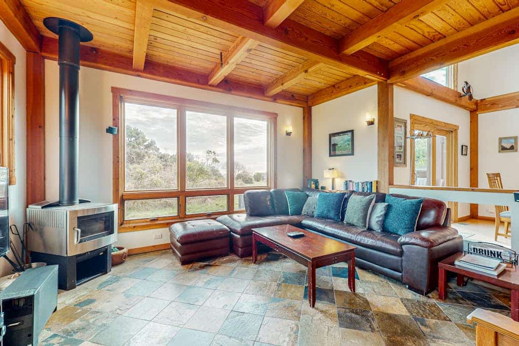 A short walk to a tree-lined trail connects your front door to the bluffs and the Pacific. Bring your pup -- dogs love the bluff trails here. Curl up by the wood burning stove as fog rolls in off the Pacific. Room for 7 in this 3-bedroom home. Just a 1-minute walk to the Del Mar Recreation Center with a heated community pool, saunas, community garden and tennis courts. Trails, tidepools, pickleball courts, golf and two heated community pools -- all within reach. The rugged Sonoma coastline unfolds from the deck -- raw, dramatic, and endlessly watchable. 