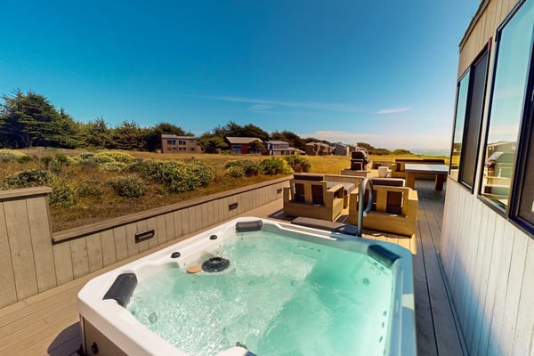 Sip your morning coffee with sweeping ocean panoramas from this Sea Ranch perch. Soak in the hot tub as the sun dips below the Pacific. A warm fire and ocean views anchor cozy evenings in. Room for 6 in this 3-bedroom home. Near the heated community pool. The Sonoma Coast's best-kept secret is waiting for you. Watch the fog roll in from the deck as the coastline disappears and reappears like magic.
