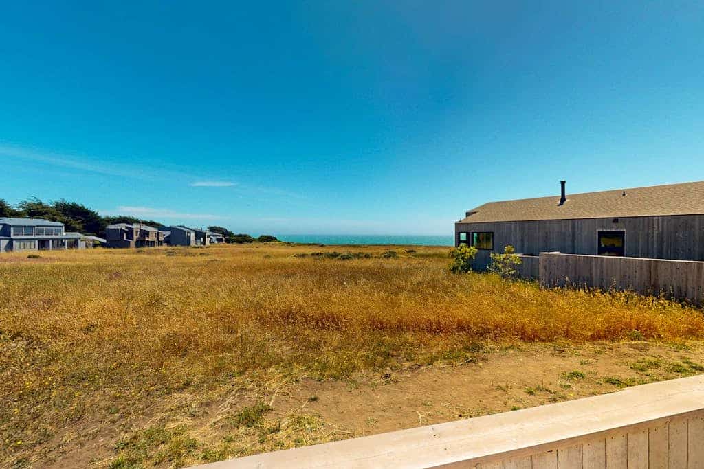 Sip your morning coffee with sweeping ocean panoramas from this Sea Ranch perch. Soak in the hot tub as the sun dips below the Pacific. A warm fire and ocean views anchor cozy evenings in. Room for 6 in this 3-bedroom home. Near the heated community pool. The Sonoma Coast's best-kept secret is waiting for you. Watch the fog roll in from the deck as the coastline disappears and reappears like magic.