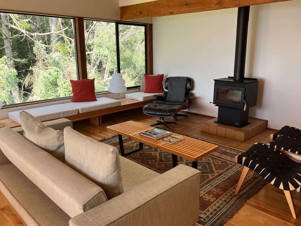 Perched above the iconic Knipp-Stengel Barn with sweeping ocean and forest views, this timber-framed Sea Ranch retreat blends bold architecture with coastal calm. Soak in the private hot tub under the stars, hike blufftop trails from your doorstep, or settle into the sun-drenched window seats and watch the world slow down.

Two bedrooms, two baths, and an open great room with soaring timber beams -- designed for couples or small groups chasing quiet, beauty, and adventure on the Sonoma Coast.