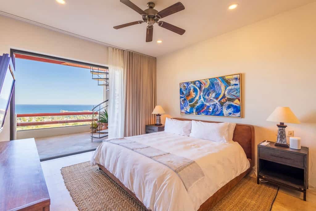 Luxury condo in Alegranza, San José del Cabo, featuring an open concept layout with a fully equipped kitchen, bright living area, and private terrace with partial ocean views. Comfortable bedrooms offer privacy and modern amenities. Enjoy a spacious private rooftop with lounge areas, pergola, and outdoor kitchen, perfect for relaxing or entertaining. Gated community with pools, tennis courts, gym, and prime location near beaches, dining, and golf.