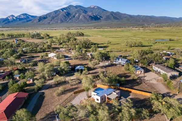 Welcome to Medina Casita, a sunlit adobe home in El Prado just minutes from Taos. Gather on the covered porch around the firepit, fire up the grill, and take in mountain views under wide New Mexico skies. Inside, three bright bedrooms, a full kitchen, and cozy Southwest touches make it easy to settle in. Bring the dog, explore Taos Pueblo, the Rio Grande Gorge, and world class skiing, then return to your own peaceful high desert retreat.