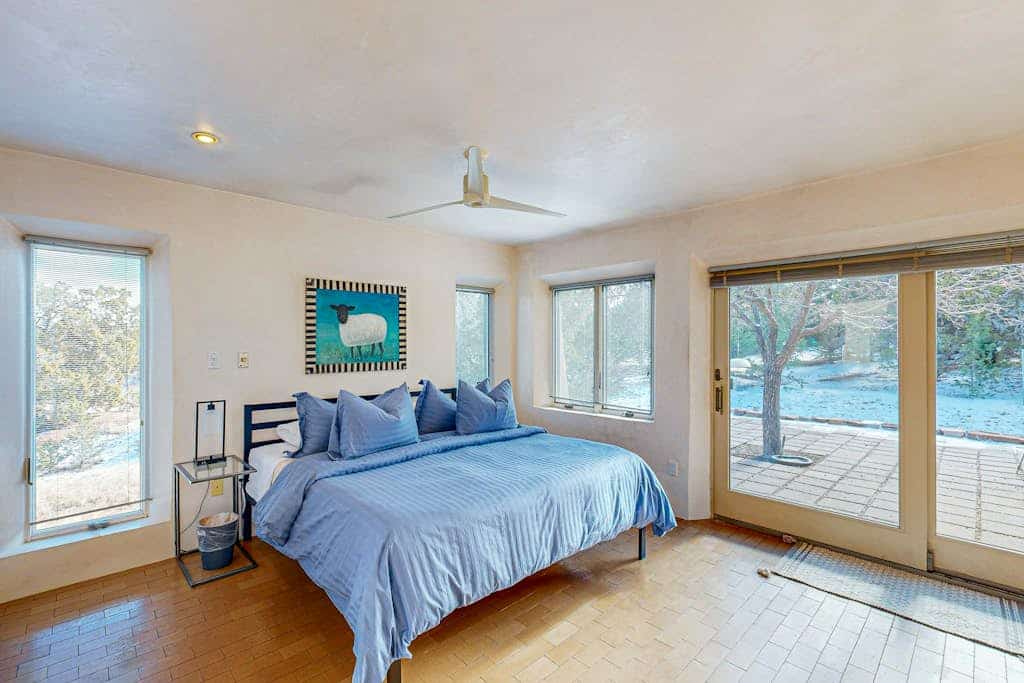 Escape to this secluded and peaceful home in Santa Fe, perfect for those looking to unwind and enjoy a quiet retreat. Tucked Away in Santa Fe combines modern design and clean aesthetics to provide a serene atmosphere, while a wood burning stove and additional wood burning fireplace add a cozy touch to your stay. Ideal for longer stays, remote workers, or traveling nurses, this single level home offers a beautiful blend of convenience, comfort, and New Mexico tranquility.
