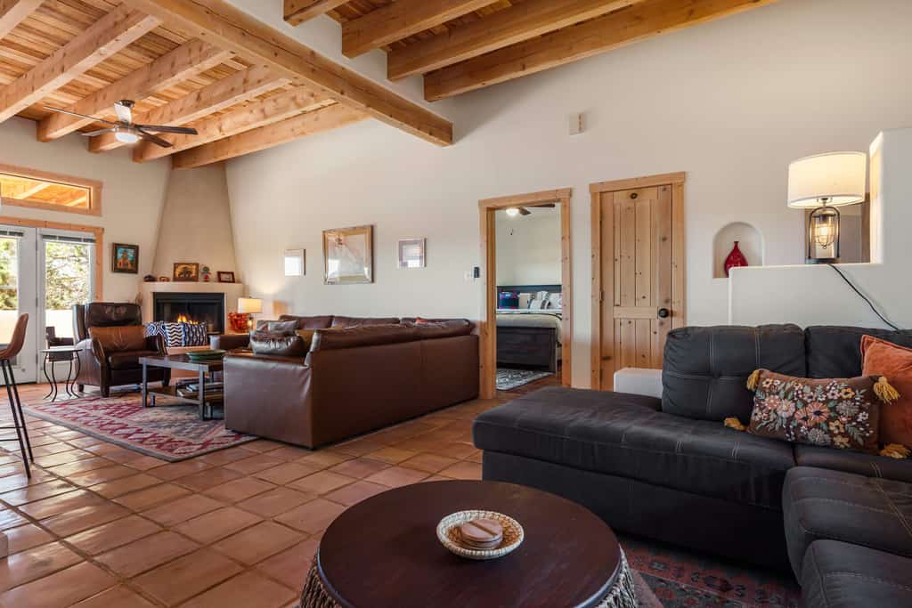 Laguna Azul is a peaceful 3-bedroom retreat in the Eldorado area just outside Santa Fe, with wide mountain views, star-filled skies, and easy single-level living. Gather by the fireplace in the open living area, cook in the full kitchen, and dine on the covered patio with a grill as the sun sets. Dog-friendly and surrounded by high-desert trails, it is an ideal base for families, friends, and anyone craving space, scenery, and a slower reset.