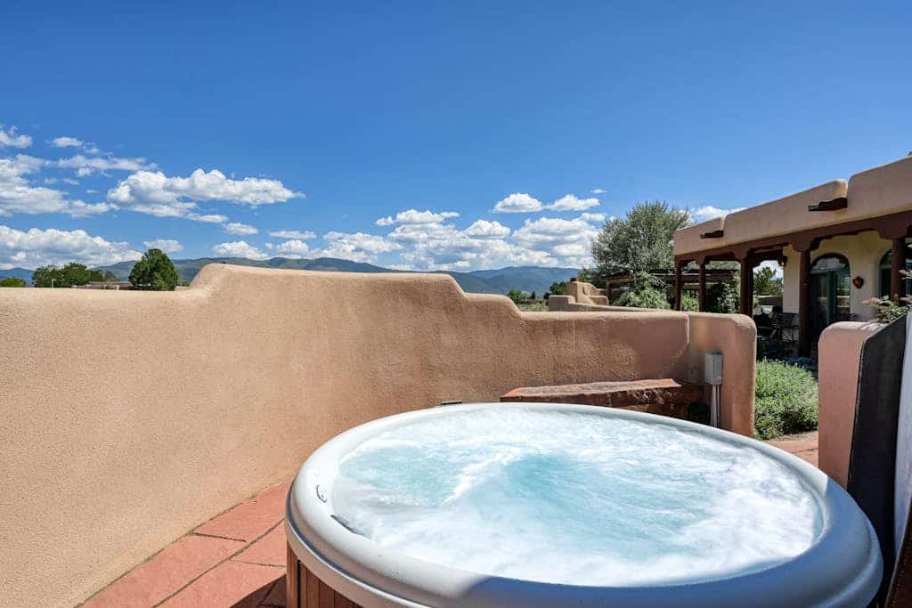 Experience classic New Mexico charm at Taos Mountain House, a peaceful adobe retreat surrounded by sweeping mountain views. With space for up to 12 guests, 4 bedrooms, multiple living areas, and dog-friendly accommodations, this home is designed for families and groups looking to relax, reconnect, and explore Taos and Taos Ski Valley. After a full day outdoors, unwind in the private hot tub, gather around the firepit, or settle in by the wood-burning fireplace for a cozy evening in.