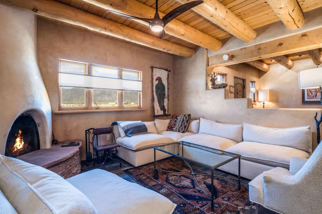 Welcome to Hora Feliz, a single-level adobe escape in El Prado, set between Taos and the ski valley with sweeping Sangre de Cristo views. Sip morning coffee beneath viga ceilings, gather in the open kitchen, and challenge the family to ping-pong in the game room. Outside, soak in the private hot tub, grill dinner on the covered patio, and watch the sun set over the mountains from your fully fenced, dog-friendly yard. Your happy hour in the high desert starts here.