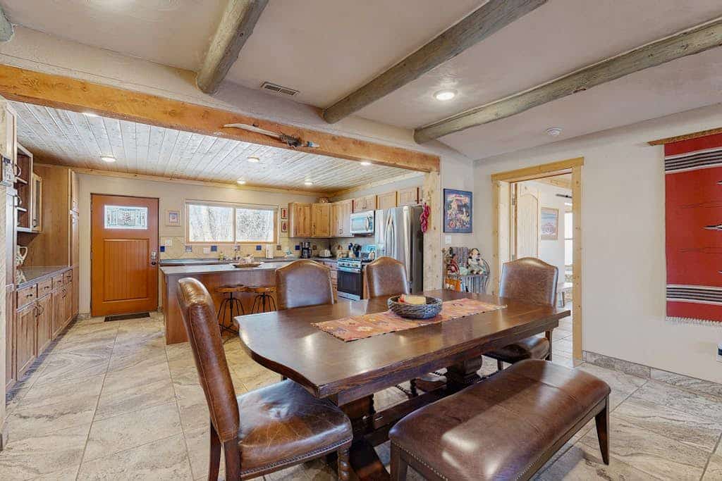 Welcome to Casa de Rufina, an extensively remodeled Arroyo Seco home with sweeping views of El Salto Mountain and Canyon. Cook in a sleek island kitchen, unwind in a primary suite with a jacuzzi tub and kiva fireplace, and grill out under the gazebo. As the sun sets over the mountains, gather at the firepit beneath skies of orange and pink. Dog-friendly and minutes from Arroyo Seco's eateries, it's an ideal Northern New Mexico family retreat.