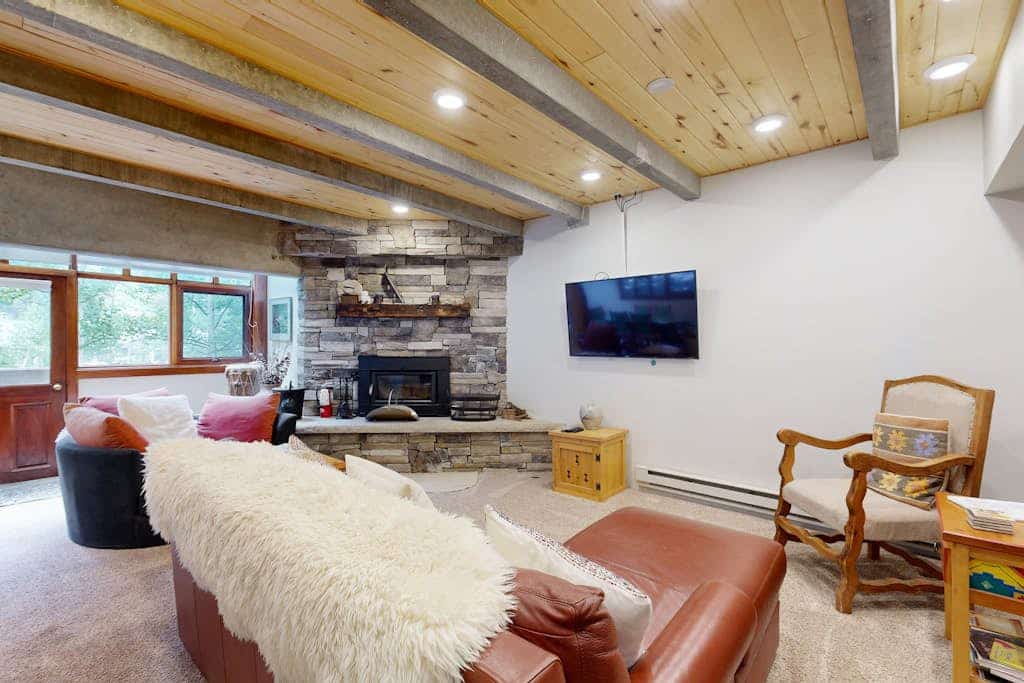 Step into architectural history at Predock 2F, a striking Taos Ski Valley retreat designed by renowned architect Antoine Predock. Nestled in the heart of the village, this rustic-chic condo blends mountain charm with modern comfort. Walk just minutes to the slopes, unwind by the wood-burning fireplace, or take in the iconic “Taos Glow” from your private balcony. With peaceful concrete walls and easy access to hiking, skiing, and village dining, this is your perfect alpine escape.