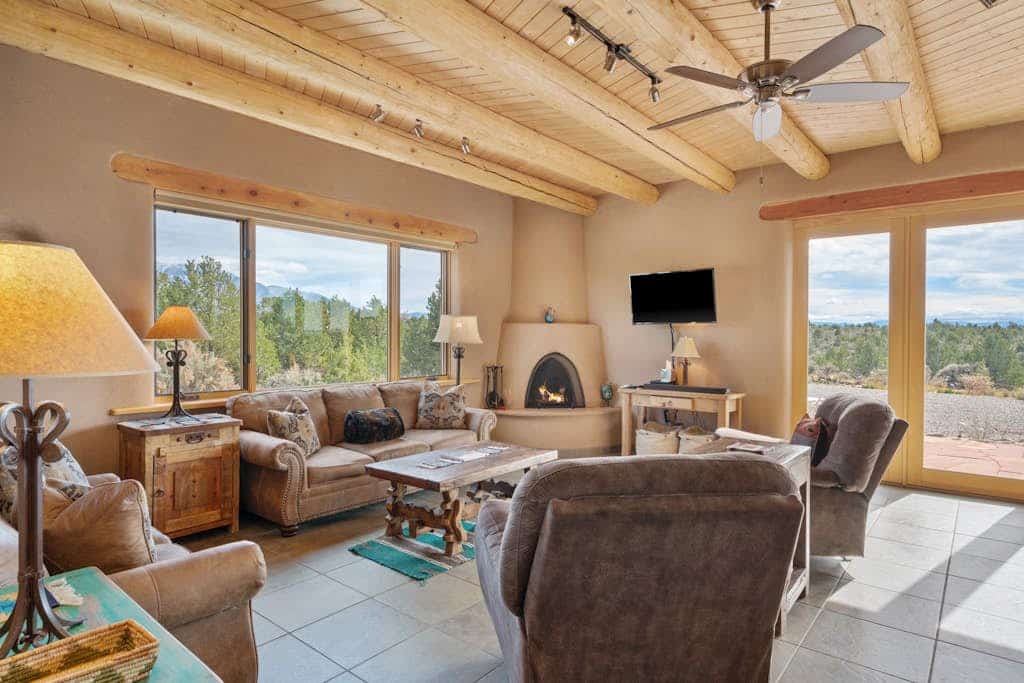 Welcome to Casa Cielo, a guest favorite adobe hideaway north of Taos where big skies and privacy set the tone. Soak in the hot tub under a blanket of stars, sip morning coffee on the expansive patio, or settle in for sunset with sweeping mountain views. Inside, there's viga ceilings, a kiva fireplace, and large windows framing the high desert landscape. With a gourmet kitchen and generous outdoor space for dining and relaxing, this 2,500 sq ft retreat invites you to slow down and reconnect.