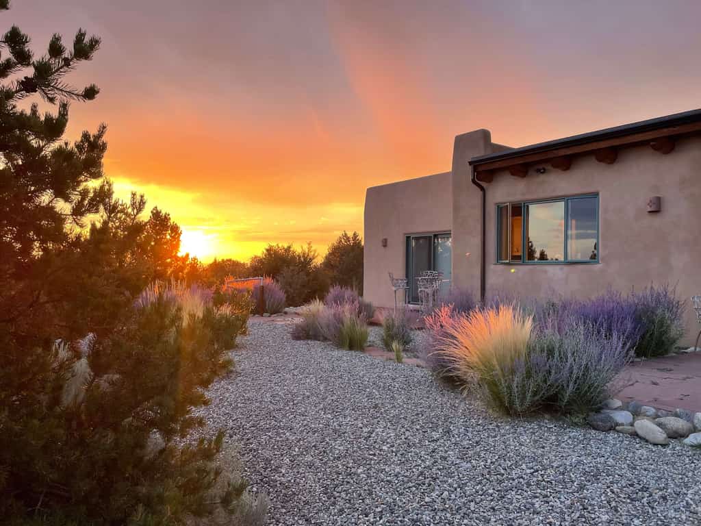Welcome to Casa Cielo, a guest favorite adobe hideaway north of Taos where big skies and privacy set the tone. Soak in the hot tub under a blanket of stars, sip morning coffee on the expansive patio, or settle in for sunset with sweeping mountain views. Inside, there's viga ceilings, a kiva fireplace, and large windows framing the high desert landscape. With a gourmet kitchen and generous outdoor space for dining and relaxing, this 2,500 sq ft retreat invites you to slow down and reconnect.