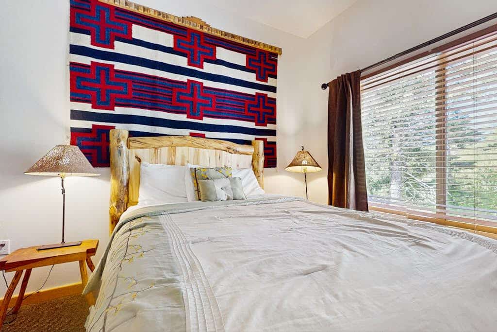 Welcome to Sweet Retreat, your cozy mountain basecamp tucked into the pines of Taos Ski Valley. This updated third-floor condo pairs a warm, light-filled living space with a fireplace, a full kitchen, and forest views from nearly every window. Ski the mountain just up the road, soak in the quiet of the stream across the way, then unwind in the shared fitness room and game room steps from your door. Whether you are here for powder days or a peaceful reset, this is your home away from home.