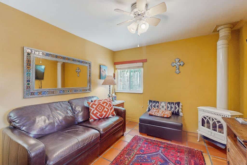 Welcome to Casita Antonio, a cozy, art-filled adobe casita just a short walk from the heart of Taos. Sip morning coffee on the private, coyote-fenced patio, cook in a sunny full kitchen, and unwind by the gas fireplace under a beamed ceiling. With a queen bedroom plus a sofa bed and a dog-friendly welcome, this single-level retreat is a charming, budget-friendly base for exploring the Plaza, galleries, and the high desert.