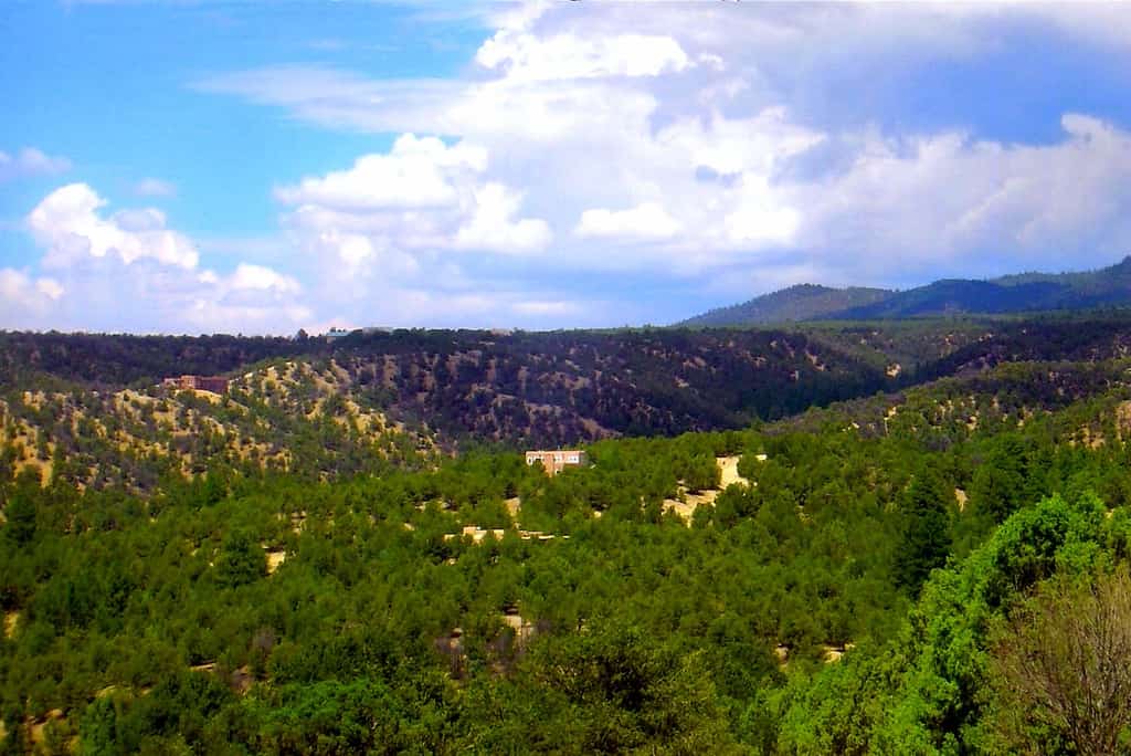 Welcome to Pueblo de Canoncito, an elegant Southwestern retreat on 11 private acres bordering national forest just outside Taos. Pueblo-inspired architecture, saltillo tile, and timber ceilings set a serene tone, while a walled courtyard and forest-view patio with a kiva-style outdoor fireplace invite slow mornings and starlit evenings. Cook in the full kitchen, warm up by the wood-burning fireplace, and let your dog roam. With room for nine, it's a peaceful, scenic basecamp.