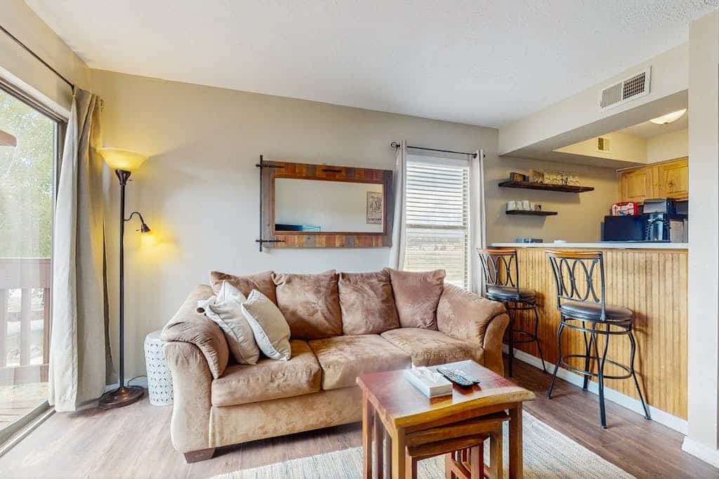 Unwind in the heart of the mountains at Christi Villa 100, a beautiful condo designed for easy living and romantic getaways. Just a half-mile from Angel Fire Resort, this inviting retreat pairs rustic wood accents with modern comforts. Start your morning with coffee on the private balcony and end your evening streaming your favorite movies by the fire. Whether you are here to hit the ski slopes, conquer the mountain bike trails, or simply recharge, this condo provides the perfect basecamp for your New Mexico adventures. 
