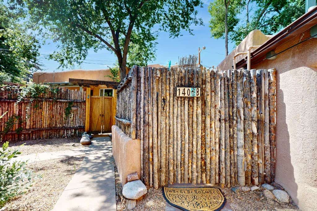 Welcome to Casita Tesoro, a charming, elegantly appointed studio hidden in the middle of everything, just blocks from downtown Santa Fe and the Plaza. Enjoy the warm glow of the gas fireplace, cook in the full kitchen, and relax in a private Southwestern-style courtyard shaded by trees. With air conditioning, fast Wi-Fi, and a dog-friendly welcome, this adobe treasure is the perfect base for exploring Santa Fe's art, food, and culture on foot.