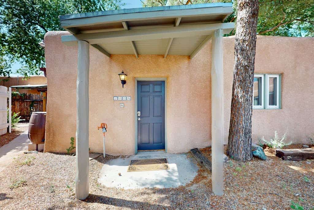 Welcome to Casita Tesoro, a charming, elegantly appointed studio hidden in the middle of everything, just blocks from downtown Santa Fe and the Plaza. Enjoy the warm glow of the gas fireplace, cook in the full kitchen, and relax in a private Southwestern-style courtyard shaded by trees. With air conditioning, fast Wi-Fi, and a dog-friendly welcome, this adobe treasure is the perfect base for exploring Santa Fe's art, food, and culture on foot.