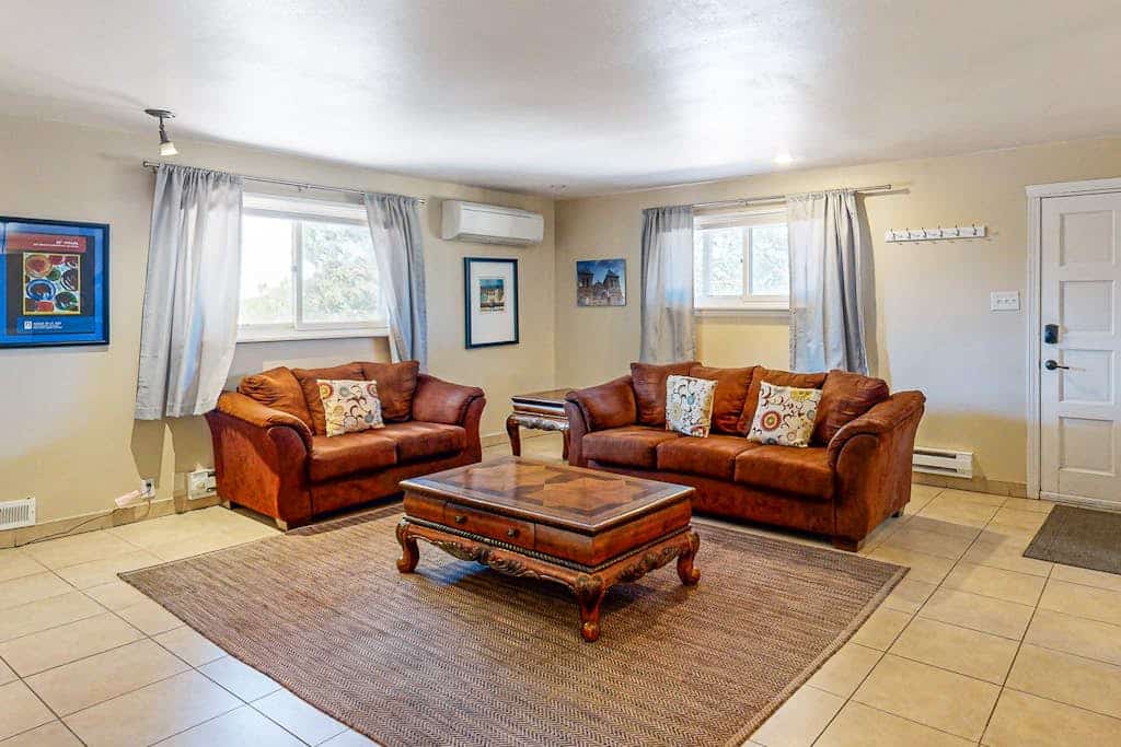 Escape to Old Santa Fe Manor, a peaceful dual-suite retreat set on three private acres with sweeping mountain views and serene high-desert surroundings. Just ten minutes from Santa Fe Plaza, this secluded getaway offers easy access to galleries, dining, and outdoor adventure while providing a quiet place to unwind. Enjoy cozy evenings by the wood-burning fireplaces, spacious light-filled interiors, and brand-new heating and cooling for year-round comfort.
